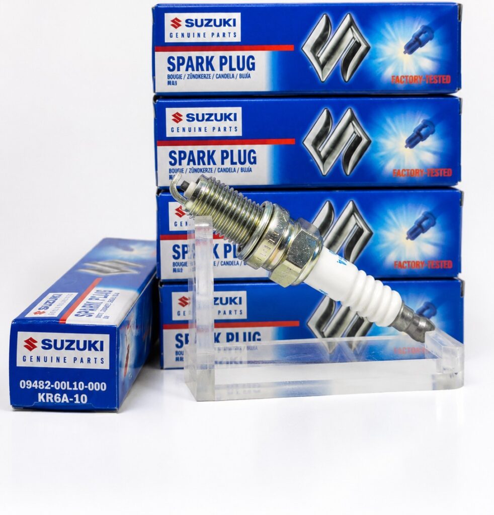 Suzuki Genuine Parts Spark Plug 09482-00L10-000 / NGK KR6A-10 — genuine Suzuki packing mein standard spark plug, reliable ignition aur smooth engine performance ke liye.